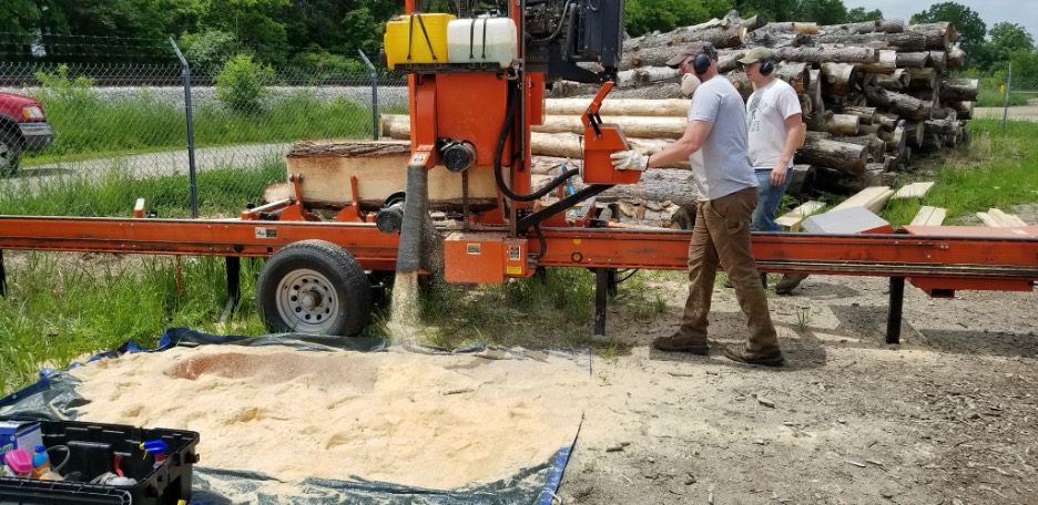Processing wood into sawdust